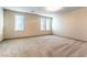 A well-lit bedroom featuring neutral paint, carpet flooring, and large windows at 8012 Carpenter Creek Ave, Las Vegas, NV 89113