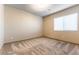 Neutral bedroom with plush carpeting, and one window at 8012 Carpenter Creek Ave, Las Vegas, NV 89113