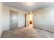 Neutral bedroom with carpet flooring, two entryways, and ample space at 8012 Carpenter Creek Ave, Las Vegas, NV 89113