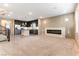 Bright and airy living area with a fireplace and views into the modern kitchen at 8012 Carpenter Creek Ave, Las Vegas, NV 89113