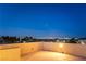 This outdoor patio offers views of the city skyline and swaying palm trees for relaxation at 8012 Carpenter Creek Ave, Las Vegas, NV 89113