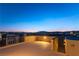 Rooftop patio with views of the city skyline and distant mountains provides an ideal outdoor retreat at 8012 Carpenter Creek Ave, Las Vegas, NV 89113