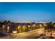 Charming street view with lush trees, manicured lawns, and a view of the city skyline at 8012 Carpenter Creek Ave, Las Vegas, NV 89113