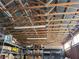 View of raftered ceiling in storage building with flourescent lighting and hanging chain at 81 W Mesquite Ave, Pahrump, NV 89060