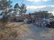 View of land showing gravel ground and metal equipment for storing materials and equipment at 81 W Mesquite Ave, Pahrump, NV 89060