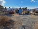 View of land showing gravel ground and metal equipment for storing materials and equipment at 81 W Mesquite Ave, Pahrump, NV 89060