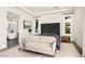 Bright and airy main bedroom with a sitting area, large windows, and modern minimalist decor at 826 Willits St, Las Vegas, NV 89138