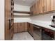 Well-organized pantry with custom wood cabinets, open shelving, quartz countertops, and a built-in wine fridge at 826 Willits St, Las Vegas, NV 89138