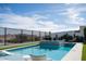 Beautiful pool and spa with lounge chairs, landscaping, and scenic mountain views on a sunny day at 826 Willits St, Las Vegas, NV 89138