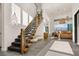 Modern staircase leading to the upper level, complemented by natural light and open living spaces at 826 Willits St, Las Vegas, NV 89138