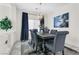 Bright dining room with a modern chandelier and large window offers a stylish space for meals at 8573 Silver Coast St, Las Vegas, NV 89139