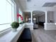 Open-concept living room featuring a sitting bench and a view of the entryway columns and archway at 8573 Silver Coast St, Las Vegas, NV 89139