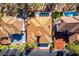 Aerial view of the property highlighting the backyard swimming pool, desert landscaping, and red-tiled roof at 8649 Robinson Ridge Dr, Las Vegas, NV 89117