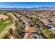 Neighborhood aerial view showcasing the golf course, mature trees, and desert landscaping at 8649 Robinson Ridge Dr, Las Vegas, NV 89117