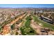 Panoramic aerial view of the golf course community with mature trees and distant mountain views at 8649 Robinson Ridge Dr, Las Vegas, NV 89117