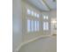 Bright bedroom featuring multiple windows with white shutters and neutral carpeting at 8649 Robinson Ridge Dr, Las Vegas, NV 89117