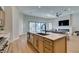 Bright kitchen featuring modern appliances, light wood cabinets, and a large center island with a sink at 8649 Robinson Ridge Dr, Las Vegas, NV 89117