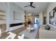 Bright open concept living room with stone fireplace and seamless flow to dining at 8649 Robinson Ridge Dr, Las Vegas, NV 89117