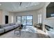 Inviting living room with a modern fireplace, a comfortable seating area, and scenic pool view at 8649 Robinson Ridge Dr, Las Vegas, NV 89117