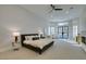 Spacious main bedroom with black ceiling fan and a decorative fireplace at 8649 Robinson Ridge Dr, Las Vegas, NV 89117