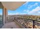 Scenic balcony view with decorative railing overlooking palm trees and mountains at 9103 Alta Dr # 404, Las Vegas, NV 89145