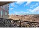 Balcony with ornate iron railing overlooking city and desert landscape at 9103 Alta Dr # 404, Las Vegas, NV 89145