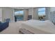 Spacious bedroom featuring a private balcony with mountain views and a cozy sitting area at 9103 Alta Dr # 404, Las Vegas, NV 89145