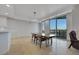 Well-lit dining area featuring a sleek chandelier and a view of the city at 9103 Alta Dr # 404, Las Vegas, NV 89145