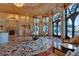 Elegant foyer featuring a decorative fireplace, inlaid marble flooring, and crystal chandeliers at 9103 Alta Dr # 404, Las Vegas, NV 89145