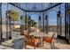 Elegant outdoor gazebo with ironwork, stone flooring, and a dining set that offers a relaxing space with beautiful views at 9103 Alta Dr # 404, Las Vegas, NV 89145