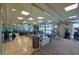 Spacious gym with mirrored walls, wood floors, and a variety of exercise equipment at 9103 Alta Dr # 404, Las Vegas, NV 89145