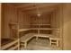 Wood paneled sauna with built-in benches and a heater at 9103 Alta Dr # 404, Las Vegas, NV 89145