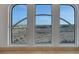 Arched windows showcase expansive desert views and cityscape in a bright and airy home at 9103 Alta Dr # 404, Las Vegas, NV 89145