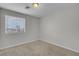 Well-lit bedroom with a large window providing natural light, complemented by a ceiling fan at 9278 Hainsworth Ave, Las Vegas, NV 89148