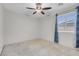 Bedroom featuring a ceiling fan, carpet flooring, and a window at 9278 Hainsworth Ave, Las Vegas, NV 89148