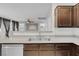 Spacious kitchen with stainless steel sink and view to connected living area at 9278 Hainsworth Ave, Las Vegas, NV 89148