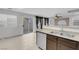 Kitchen with stainless steel dishwasher and sink, and a sliding door to the backyard at 9278 Hainsworth Ave, Las Vegas, NV 89148