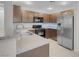 Kitchen with stainless steel appliances, granite countertops, and tile floors at 9278 Hainsworth Ave, Las Vegas, NV 89148