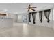 Bright living room featuring tile floors and a sliding door to the outdoor patio at 9278 Hainsworth Ave, Las Vegas, NV 89148