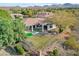 Aerial view of the home showcasing its well-maintained backyard, desert landscaping, and mountain views at 1 Club Vista Dr, Henderson, NV 89052