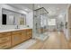 Luxurious bathroom showcasing a glass-enclosed shower, dual vanity, and soaking tub at 1 Club Vista Dr, Henderson, NV 89052