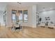 Bright dining area with modern chandelier, table, chairs, and scenic view at 1 Club Vista Dr, Henderson, NV 89052