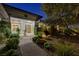 Inviting front entrance with a decorative solid wood door and lush landscaping at 1 Club Vista Dr, Henderson, NV 89052