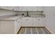 Functional laundry room with white cabinets, gray countertops, and a modern, clean design at 1 Club Vista Dr, Henderson, NV 89052