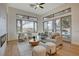 Bright living room featuring a modern fireplace, large windows and sliding glass door at 1 Club Vista Dr, Henderson, NV 89052