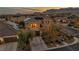 This aerial shot showcases a beautiful home with solar panels and mountain views at 10233 Madison Grove Ave, Las Vegas, NV 89166