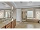 Bright primary bathroom with double sinks, a shower, and a soaking tub at 10233 Madison Grove Ave, Las Vegas, NV 89166