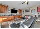 Inviting living room with custom built-ins, dark leather furniture, and memorabilia decor at 10233 Madison Grove Ave, Las Vegas, NV 89166