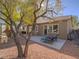 Private backyard with a patio area, lounge chairs, and well manicured landscaping at 10446 Abbotsbury Dr, Las Vegas, NV 89135