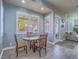 Cozy eat-in kitchen with a breakfast table and chairs by a window, with natural light at 10446 Abbotsbury Dr, Las Vegas, NV 89135